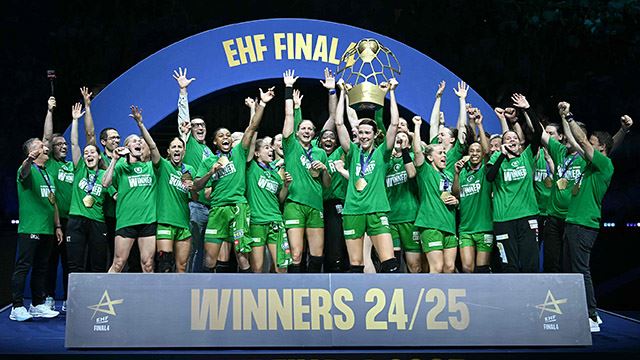 Gyor's players celebrate with the trophy after winning the EHF FINAL4 Women 2025 Champions League final handball match between Gyori Audi ETO KC (HUN) and Odense Handbold (DEN) on June 1, 2025 in Budapest, Hungary. (Photo by Attila KISBENEDEK / AFP)